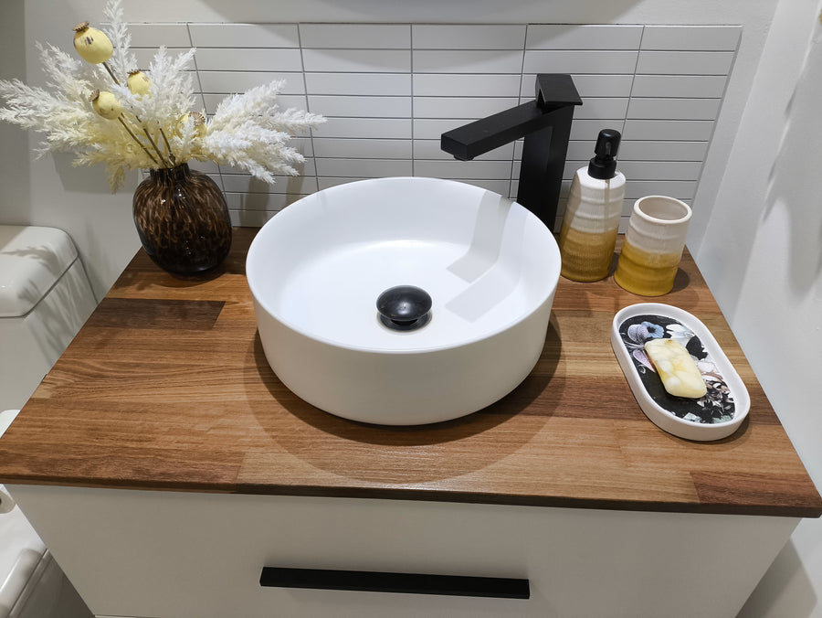 Bathroom vanity with Matte White Kit Kat Stick on Composite Tiles as a backsplash, enhancing the space with a stylish, contemporary look.