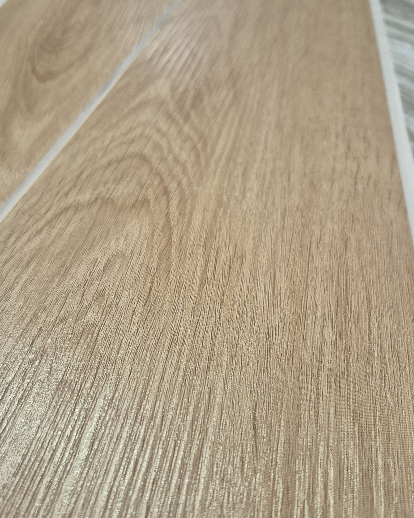Close-up of a wooden floor with visible grain and texture