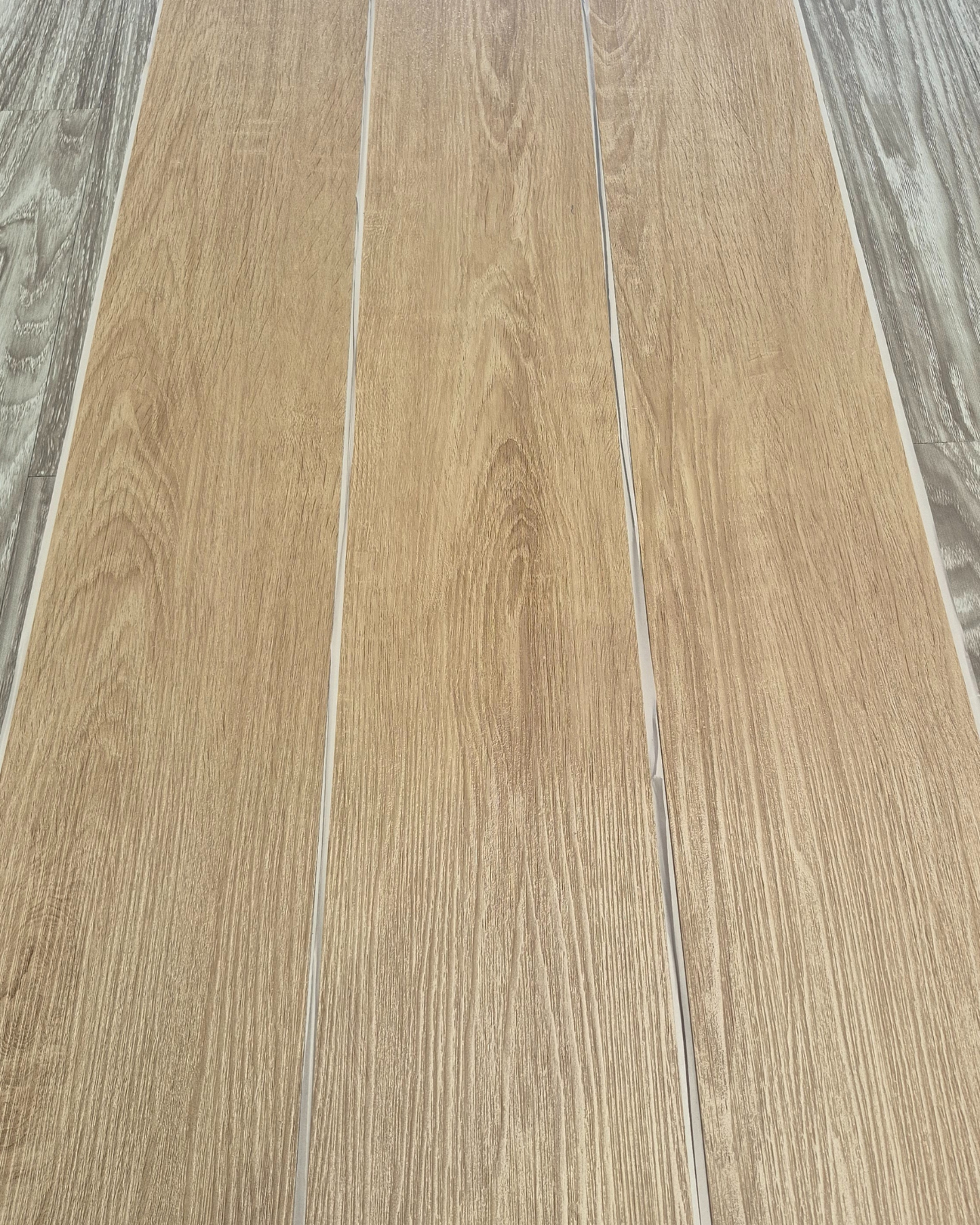 Close-up of a wooden floor with a focus on the texture and grain.