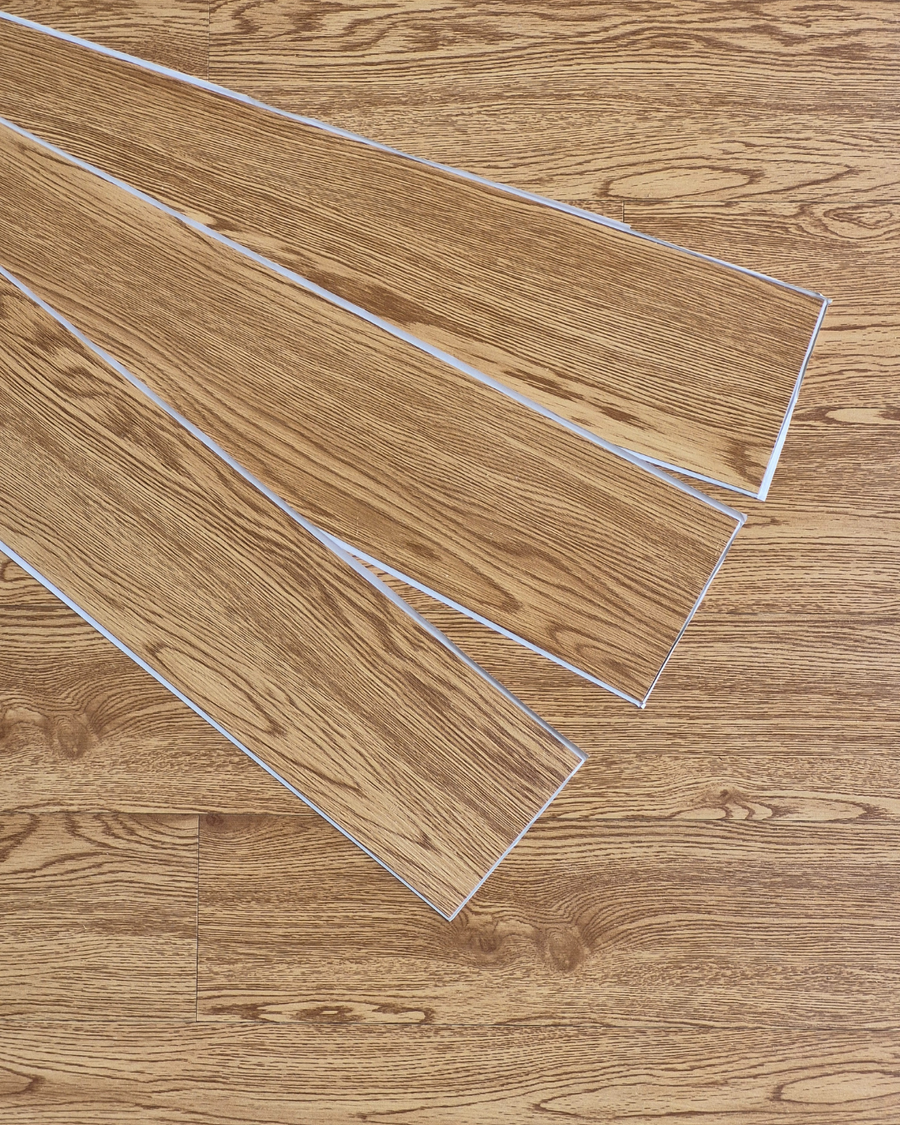 Wooden flooring panels on a wooden surface